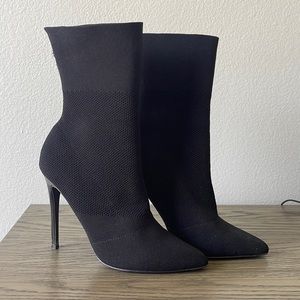 Steve Madden pull on sock booties. All over stretch knit fabric, pointed toe.